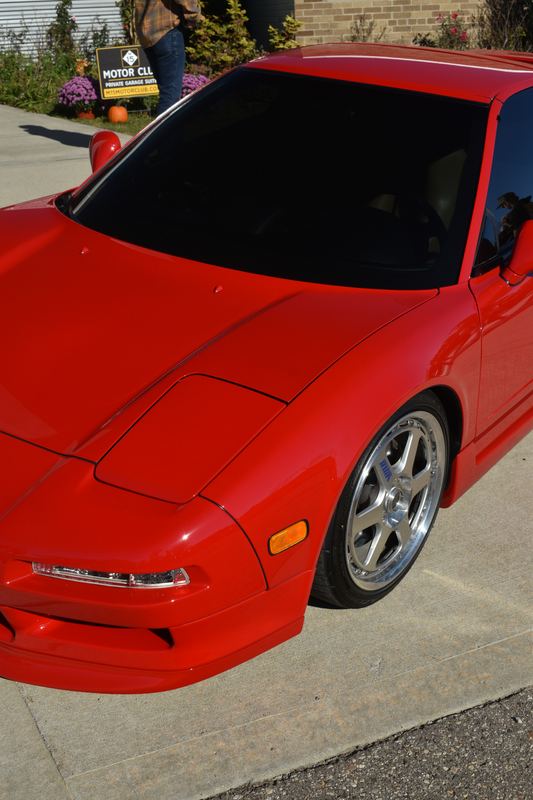 Close-up of a red Acura NSX.